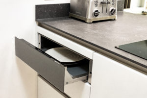 Executed project - Kitchen in Dubai Old Town, Black and White Kitchen which also has Cube system and Cosentino countertop. Shown here is the warming drawer