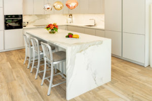 Kitchen Island in White and Grey Kitchen on Parquet floor in Dubai by Goettling interiors