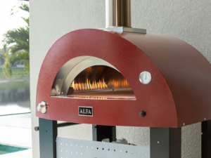 Wood fired pizza oven in dull dark red color